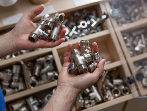 man holding air fittings